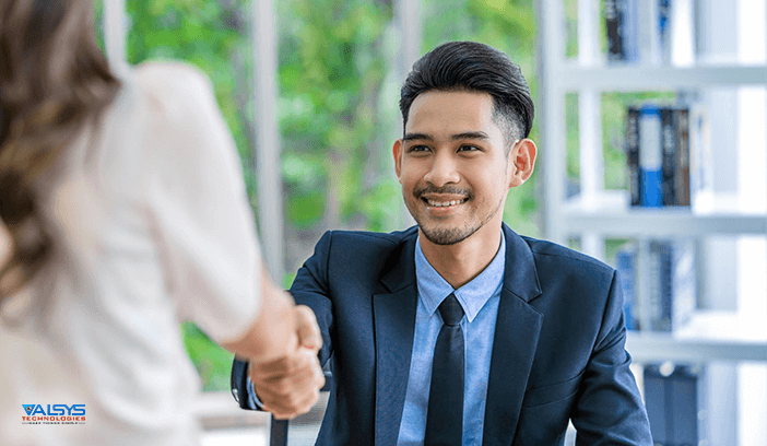employer and employee shaking hands